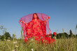 © Milou Dirks - art portrait of young asian woman wearing traditional kimono in red poppy field with thin fabric