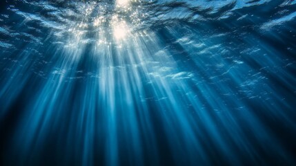 Poster - Gentle ripples dance in the water, while shafts of light break through the surface, creating a magical underwater glow. The play of light transforms the dark depths into a serene wonderland