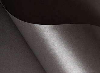 Poster - Charcoal gray paper background with a pearlescent, glossy texture and shimmering wavy edges. Deep graphite and gunmetal tones create a sleek, elegant, and luxurious abstract design.