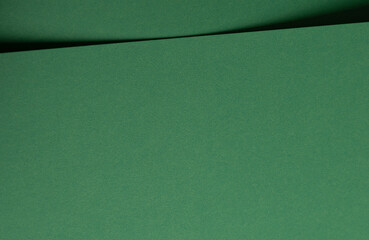 Aufkleber - Deep emerald green paper background with a smooth texture and elegant folds. Rich forest and pine tones create a refined, minimal, and artistic abstract design with subtle curves and shadows.