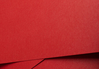 Poster - Fiery crimson paper background with a fine grainy texture and layered folds. Rich ruby and scarlet tones abstract design with dynamic contrast.
