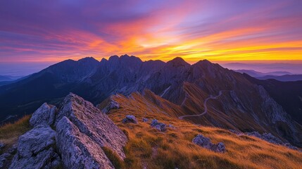 Poster - Majestic mountain range illuminated by a stunning sunset sky