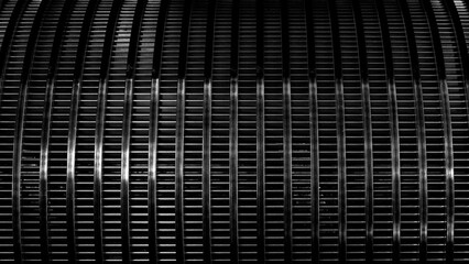 Aufkleber - Black textured metal surface background with many small squares. The photo has a dull and industrial mood.
