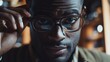 © G-Media - A man wearing glasses is looking at the camera. Concept of confidence and self-assurance