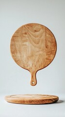 Poster - A beautifully crafted round wooden pizza board hovers effortlessly above a second board on a neutral backdrop, highlighting the natural wood texture and artisan quality