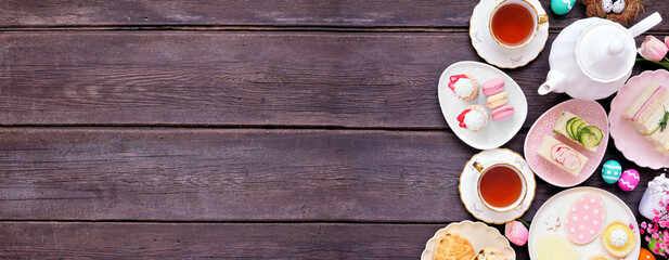 Aufkleber - Easter or spring tea side border against a dark wood banner background. Selection of finger sandwiches, scones and sweet desserts. Top view. Copy space.