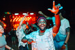 © Zamrznuti tonovi - Excited young man dancing and enjoying live music at night concert with friends