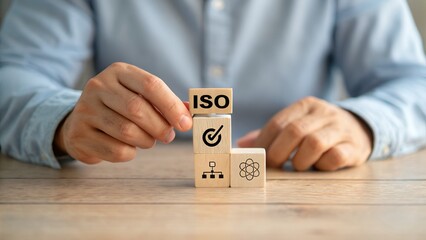 Poster - Building a Strong Foundation: Businessmen Collaborate on ISO Quality Control, Achieving Excellence Through Teamwork and Standardized Processes. Wooden Blocks   