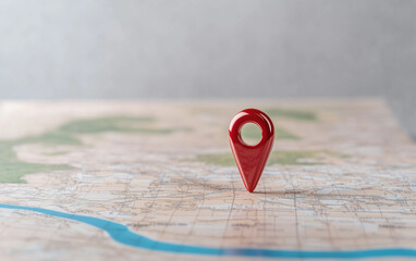 Poster - Map pin on a detailed map. Red map pin stands out on a detailed map surface