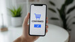 © RookStock - Online shopping confirmation screen on smartphone, concept of e-commerce, digital retail, and seamless mobile transactions