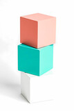 three pastel-colored cubes stacked on white background