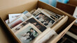 © Andres Mejia - Old photographs showing family memories stored in cardboard box