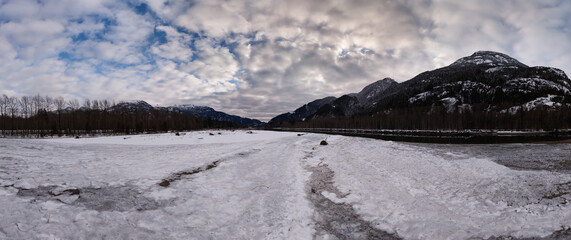 Wall Mural - Snowy Winter Landscape with Mountains and Overcast Skies in Remote British Columbia