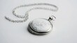 © Lush Diaries - Elegant silver locket necklace with intricate floral engraving.  A timeless piece of jewelry.