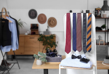 Poster - Stand with men's neckties and shirt in boutique