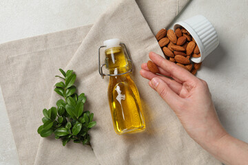 Wall Mural - Skin care and body care concept - almonds, almond oil