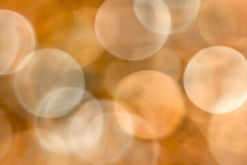 Poster - Golden Bokeh: A mesmerizing display of soft, out-of-focus, luminous spheres dances across a warm, golden backdrop, evoking a sense of enchantment and ethereal beauty.