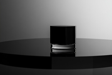Poster - Minimalist Black Cylinder on Reflective Surface: A striking black cylindrical object, likely a modern design element, sits on a glossy, reflective surface.