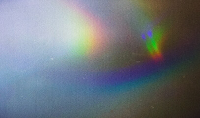 Fototapete - Abstract gradient light leak spectrum, vibrant colors, fluid motion, grainy noise texture on dark background, dreamy vintage nostalgic cinematic overlay music background design.