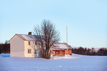 Wall Mural - beautiful winter landscape with red house (cabin) on the background sea sunset - tromso, norway