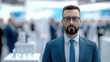 © Hanasta - Portrait of a Confident Businessman at a Convention