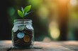 © puritut - A small plant growing out of a jar filled with coins, representing financial growth and smart investment.