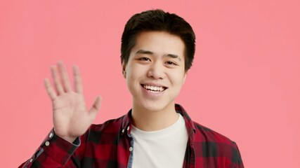 Poster - Guy smiling and waving hello, showcasing positive emotions. He conveys warmth and friendliness in a vibrant atmosphere.