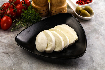 Wall Mural - Organic mozzarella cheese slices in the plate