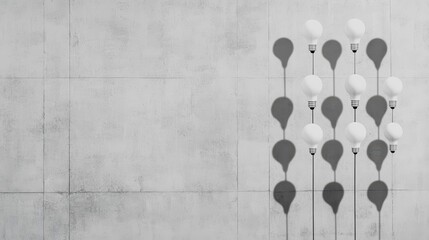 Poster - Illuminating Display of Vintage Light Bulbs Hanging Against a Rough Concrete Wall Evoking a Warm and Industrial Aesthetic in a Contemporary Setting