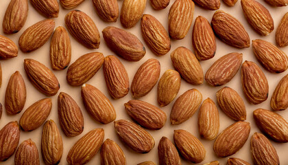 Fototapete - Repeating pattern of raw or roasted almonds, emphasizing their textured surface and warm beige tones. Ideal for healthy snacks, baking, or natural food concepts. Texture, background.