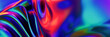 © Westend61 - 3D metallic neon wavy background with vibrant colors