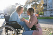 © Westend61 - Granddaughter spending leisure time holding hands of grandmother sitting on wheelchair