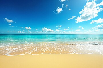 Aufkleber - Scenic tropical beach with golden sand, turquoise ocean waves, and a vibrant blue sky with scattered white clouds.