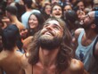 © vefimov - A man in a crowd enjoying a rock concert, looking up with a smile on his face.