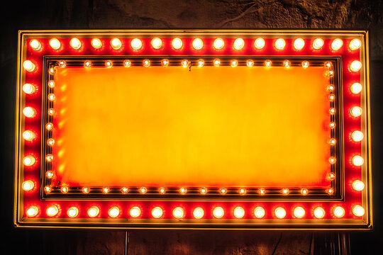 Retro marquee sign with lights, featuring a large blank space for custom messages, framed by a red and gold border
