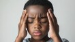 © Mykola - Touching Temples. Little boy experiencing headache and confusion