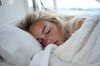 © jhx studio - Woman asleep under a blanket