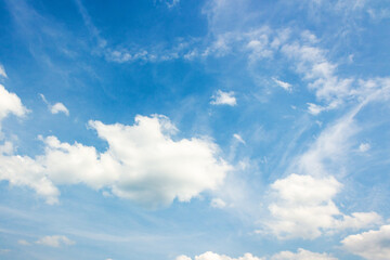 Wall Mural - sky with fluffy clouds. natural environment. white cumulus cloudscape on a blue gradient of atmosphe