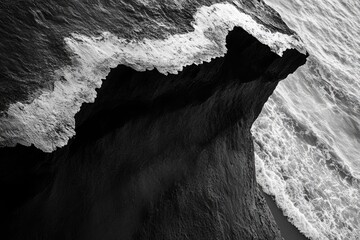 Wall Mural - a serene black and white image of the ocean's waves and shore, perfect for use in calming and peacef