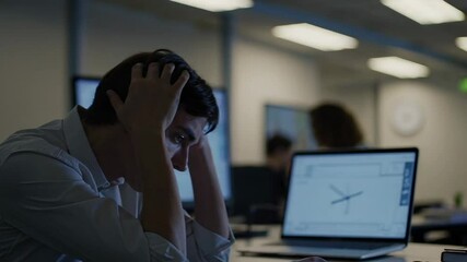 Poster - Exhausted professional experiencing intense mental strain, massaging temples while working late at night, revealing workplace stress and career pressure through slow motion sequence