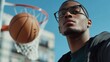 © Soulc - Myopia prevention with a man wearing glasses playing basketball outdoors. Wellness, fitness, and eye protection