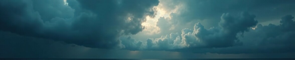 Wall Mural - dark and foreboding clouds gather on the horizon, heavy, thick, grey