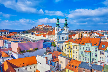 Poster - The old town of Brno with spires of Church of St Michael, modern roof of shopping mall and Spilberk citadel on background, Czech Republic