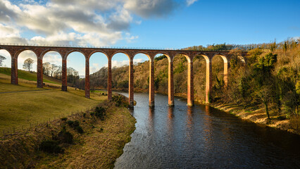Wall Mural - river tweed flows under former leaderfoot railway viaduct. the river tweed is 97 miles long from sou