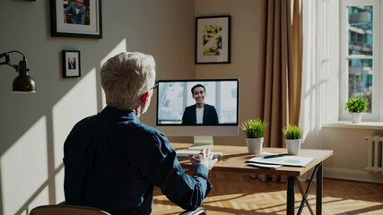 Poster - Engaging online conversation between two individuals in a modern workspace with natural light
