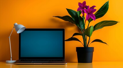 Sticker - Decluttering tips concept. Modern workspace with a laptop, lamp, and vibrant flower pot against an orange wall.