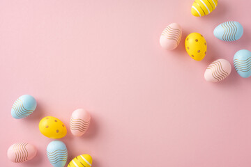 Wall Mural - decorative pastel-colored easter eggs displayed creatively on a pink background symbolizing the fest