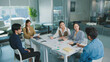 © Leny Studio - Confident Women leader discussing strategy meeting teamwork collaboration business growth analysis financial data presenting reports managing startup success corporate office people partnership