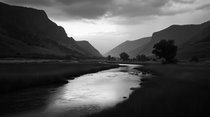 Wall Mural - a tranquil river flowing through a mountainous landscape in black and white.