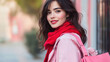 © StudioPhoto - Beautiful brunette woman in a pink jacket, in a red scarf, and a pink bag.